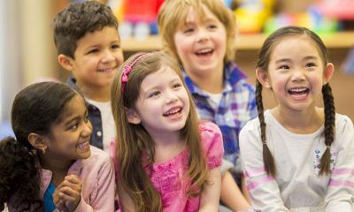 children sitting together and laughing