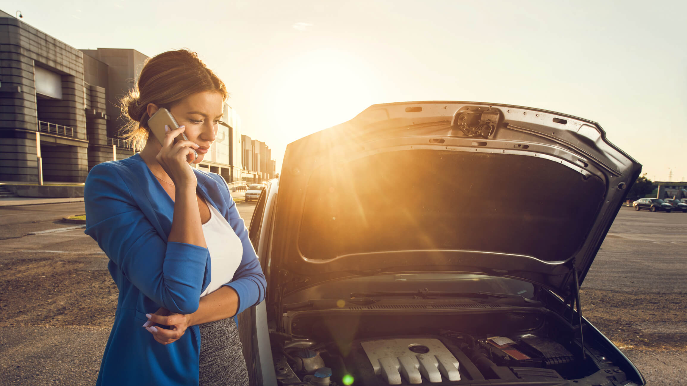 Image of woman having car problems