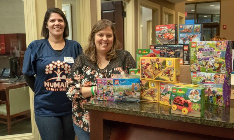 Branch Manager and Team Nicholas member with donated Legos