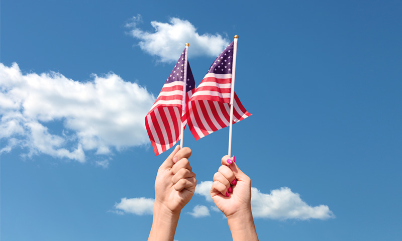 Hands holding American Flags