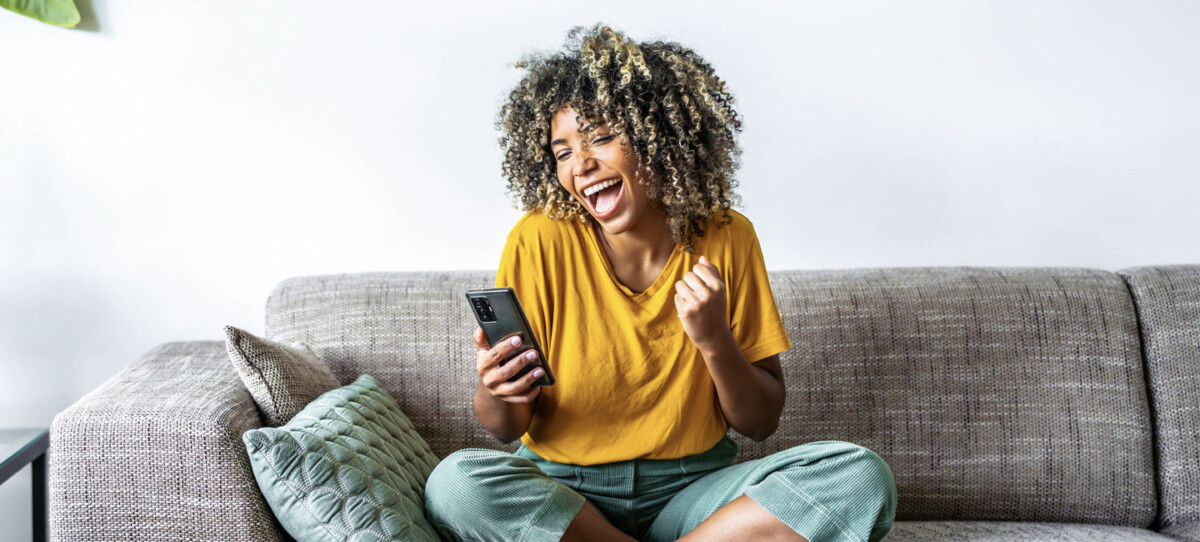 Excited Mobile Phone User
