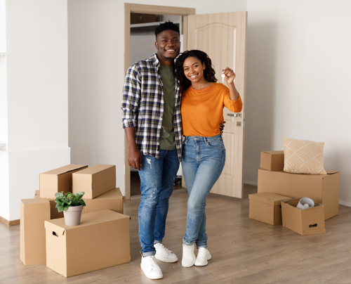 New homeowners in home with boxes around