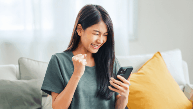 Woman on couch with mobile phone