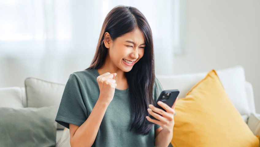 Woman on couch with mobile phone