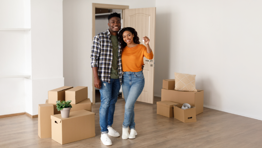 African American couple inside newly purchased home
