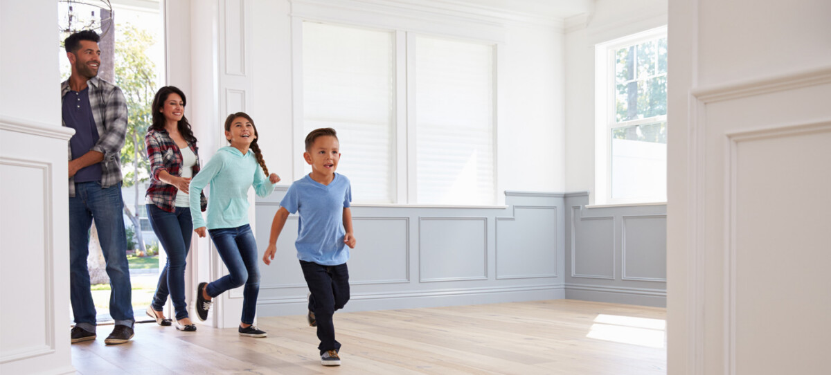 Family walking into a new home