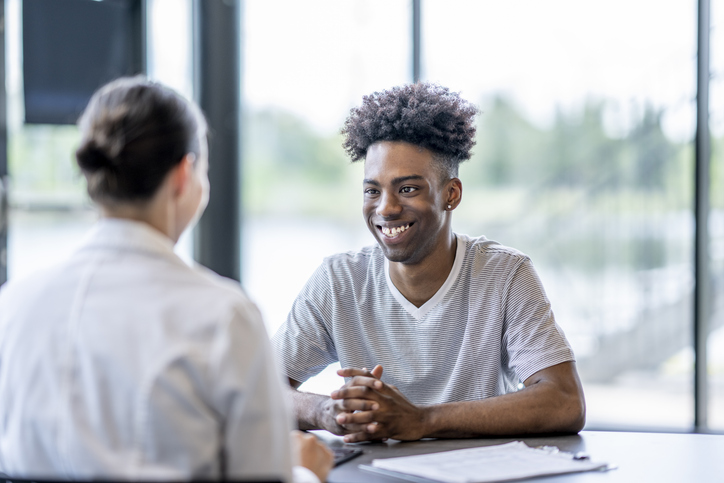 Young adult meeting with an advisor