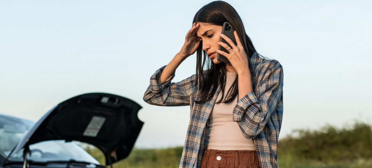Woman with broken down car
