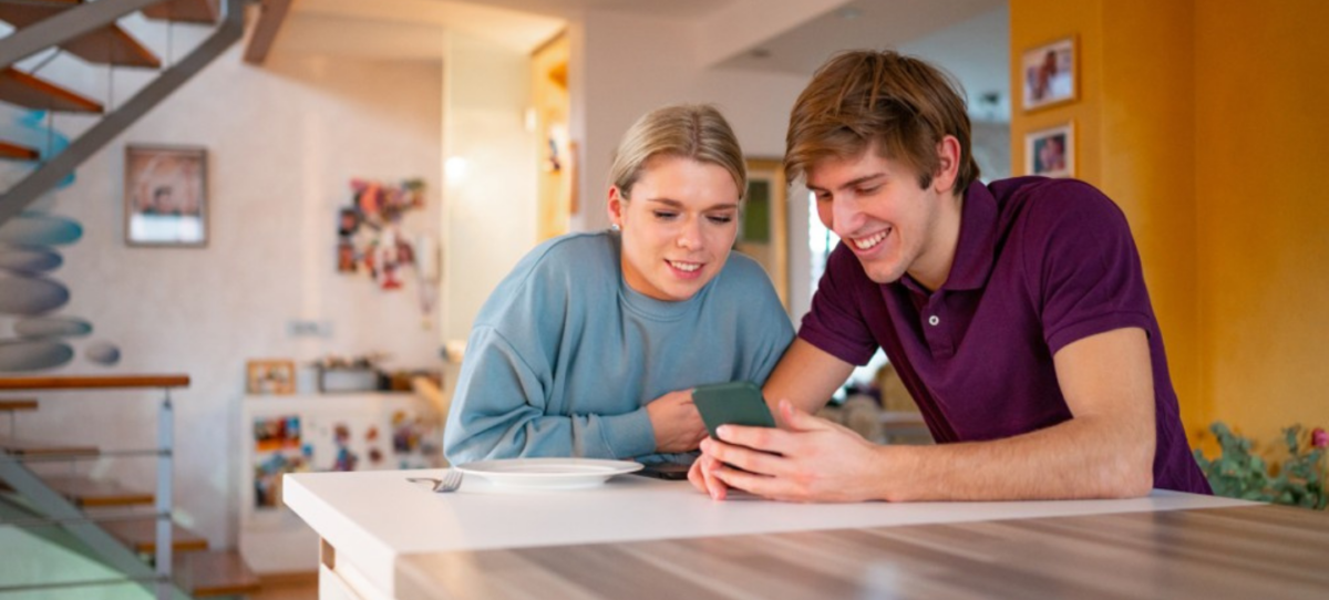 Young couple looking at phone