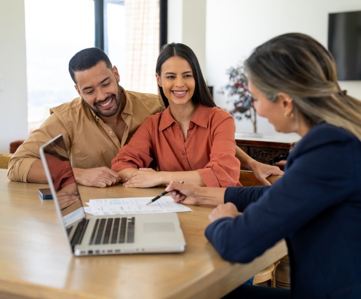 Hispanic couple meeting with a financial advisor