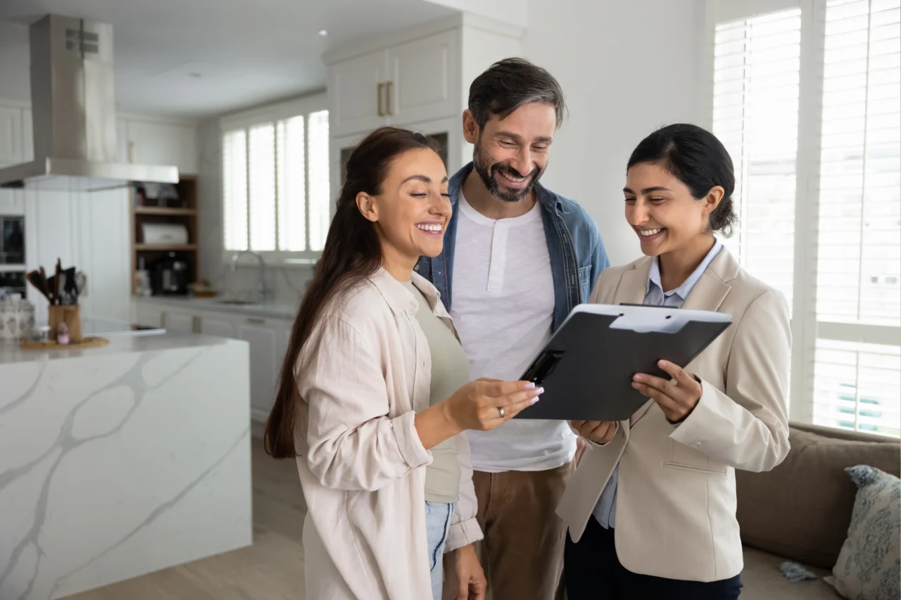 Couple looking at application with relator